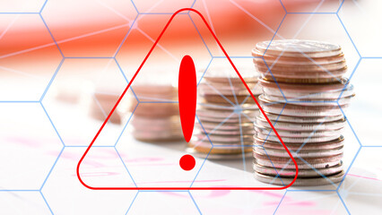 Coins against the background of a warning sign, the concept of deception in the financial and crypto sphere.. Attention virtual scammers.