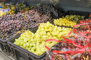Grapes in boxes are sold in a supermarket