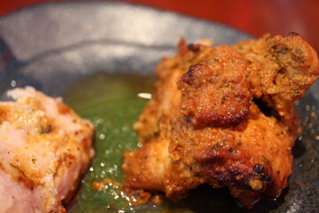 Indian cuisine: tandoori chicken (spiced and roasted chicken)