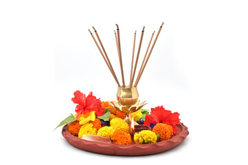 PUJA THALI FRONT LOW ANGLE VIEW ON ISOLATED ON WHITE BACKGROUND.