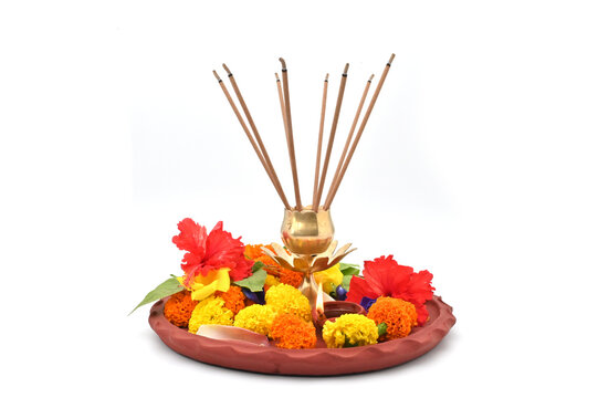 PUJA THALI FRONT LOW ANGLE VIEW ON ISOLATED ON WHITE BACKGROUND.
