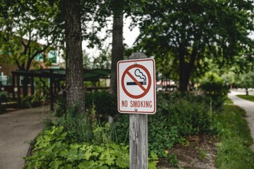 A sign in a park says no smoking