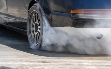Race drift car burning tires on speed track. © toa555