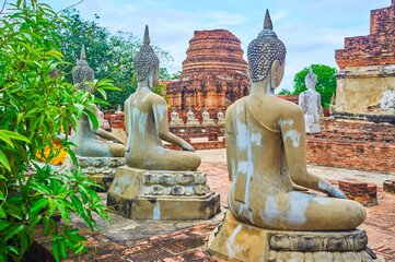 Fototapeta premium The row of Buddha statues, Wat Yai Chai Mongkhon Temple, Ayutthaya, Thailand
