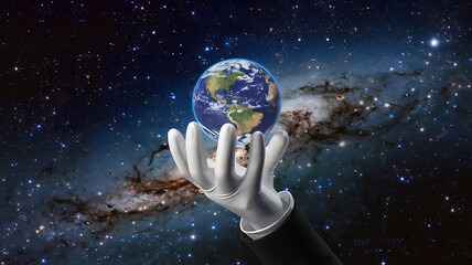 Earth held in a celestial hand.
