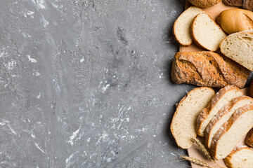 Homemade natural breads. Different kinds of fresh bread as background, top view with copy space