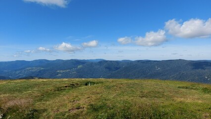 Fototapeta premium Beautiful panorama view of mid-high green mountains in Vosges, France. 