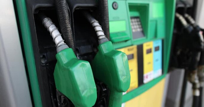 Various gas-diesel and petrol pistols at gas station. Car filling station concept