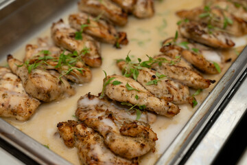 Coconut cream chicken, baked and served at an event in catering buffet dish