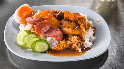 Red pork and crispy pork on rice, food in Thailand.