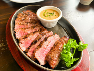 Sliced grilled medium rare Top sirloin beef steak 