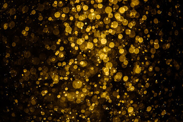 Blurred photo with golden dots visible glittering, shining brightly look and feel luxurious