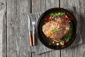 Juicy Roast Pork Neck on table, top view