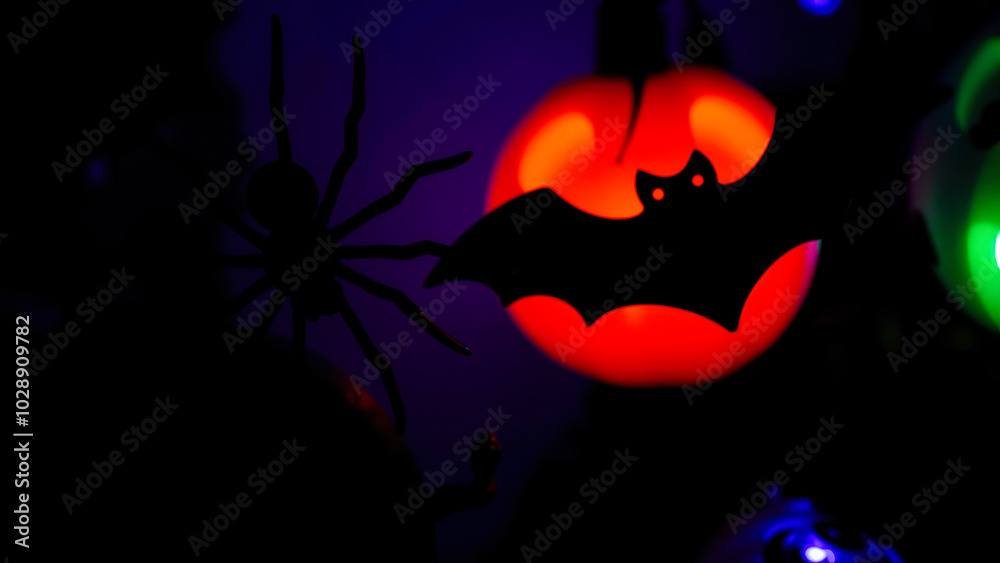 Poster glowing pumpkin with black spider bat