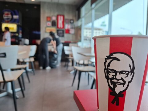 Interior of a KFC restaurant featuring the Colonel Sanders logo and seating area