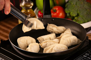 Freshly Made Gyozas with Savory Filling and Soy Sauce