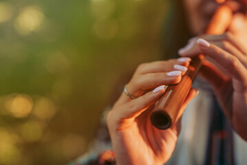 Hand Of Woman Playing On Woodwind Flute - Ukrainian Wooden Sopilka In Forest