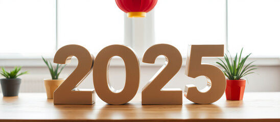 silver numerals 2025 on wooden table