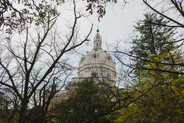 a view of a grand church with Baroque architectural elements, located in a city square.