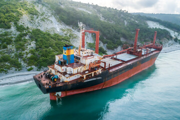 Aerial view of an abandoned bulk-carrier dry cargo ship washed ashore after a storm