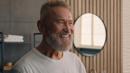 Portrait close up old Caucasian elderly male senior happy smiling toothy mature retired pensioner...