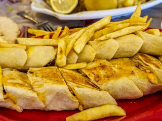 Delicious Middle Eastern Shawarma with Crispy Fries on Plate