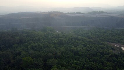 Huge open mine at the brink of the rainforest in Brazil