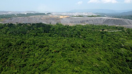 Huge open mine at the brink of the rainforest in Brazil