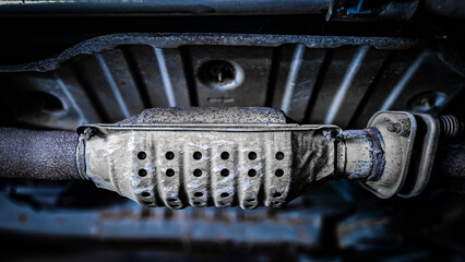 Close-up of catalytic converter under vehicle