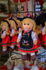 Colmar, France - June 5, 2023: Children s toys, Alsatian souvenir dolls in traditional folk outfits on display at a store in the old town