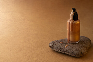 Golden shimmer body lotion on stone podium for summer product abstract ads