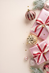 A beautiful vertical scene featuring pink wrapped gifts and elegant ornaments. This festive composition includes ribbons, baubles, and greenery, embodying the joyful essence of the Christmas season