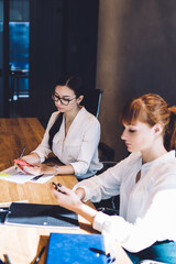 Young women on briefing in office