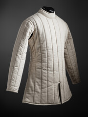 Historical fashion. Medieval knight cloth. Padded jacket gambeson.