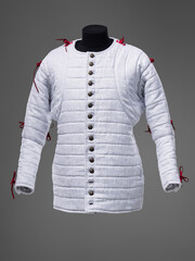 Historical fashion. Medieval knight cloth. Padded jacket gambeson.