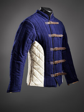 Historical fashion. Medieval knight cloth. Padded jacket gambeson.