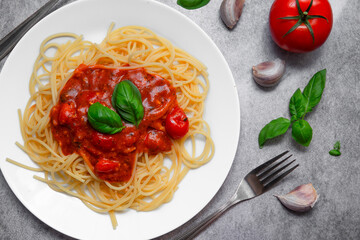 Flat Lay of Delicious Spaghetti Napoli with Fresh Tomatoes, Garlic, and Basil