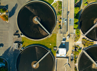 A view of a water treatment plant with three large tanks