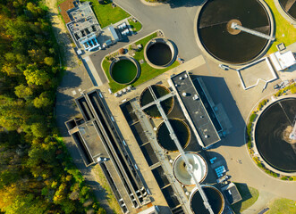 A view of a water treatment plant with several tanks and pipes