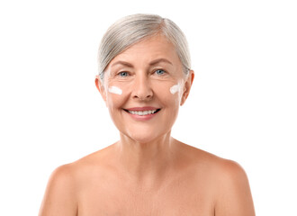 Senior woman with face cream on white background