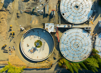 A construction site with a large round structure in the middle
