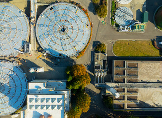 A view of a water treatment plant with a large round tank in the center