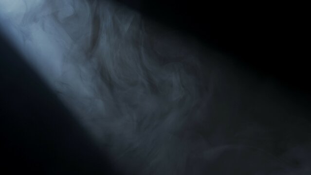 Soft diffused rays of light cut through the hazy darkness.