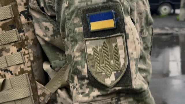 Yellow and blue chevron on the uniform of a Ukrainian soldier, a symbol of patriotism, defender of Ukraine, a sign of victory