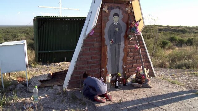 Young Boy Praying at a Ceferino Namuncura Shrine by a Rural Route, La Pampa, Argentina 