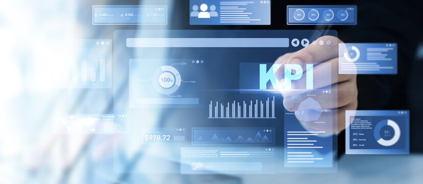 Businessman using KPI dashboard.Management data System KPI connected in database for follow earnings,operations and sales data.Financial business data analytics graph dashboard.