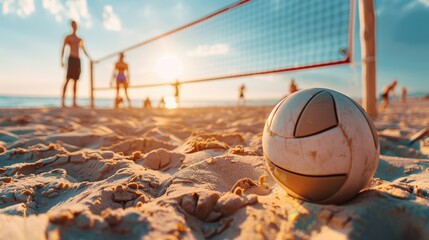 Beach volleyball sport. Close up of ball on the beach with volleyball net and players in the background, summer sport