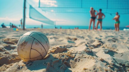 Beach volleyball sport. Close up of ball on the beach with volleyball net and players in the...