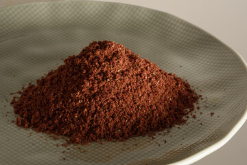 high resolution macro photography of dried and ground sumac seeds, a ready-made spice