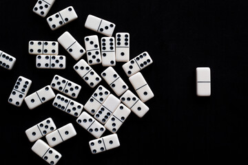 Domino tiles on black background.